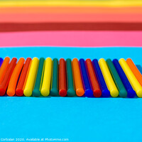 Buy canvas prints of Colorful background of plastic bars, silicone glue, on a background of colored lines. by Joaquin Corbalan