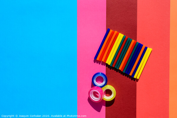 Colored background seen from above with plastic bars to use in crafts and stationery. Picture Board by Joaquin Corbalan