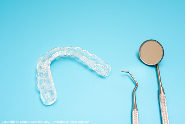 Dentist material to treat bruxism with dental splints, isolating on medical background Picture Board by Joaquin Corbalan