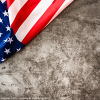 Buy canvas prints of Striking colored American flag isolated in a corner on a stone gray background. by Joaquin Corbalan