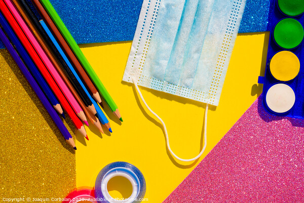 Creativity at school is developed with colorful materials and with the protection of a mask to avoid contagion, flat lay background. Picture Board by Joaquin Corbalan