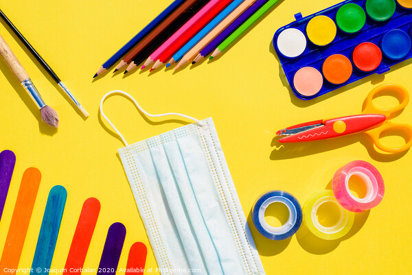 School supplies next to a face mask, flat lay background back to school. Picture Board by Joaquin Corbalan