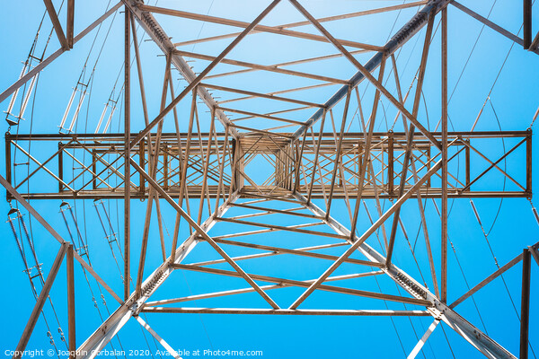Electricity is transported by thick cables attached to metal towers. Picture Board by Joaquin Corbalan