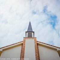 Buy canvas prints of Facade of an evangelical church with smooth white walls and a cloudy sky background. by Joaquin Corbalan