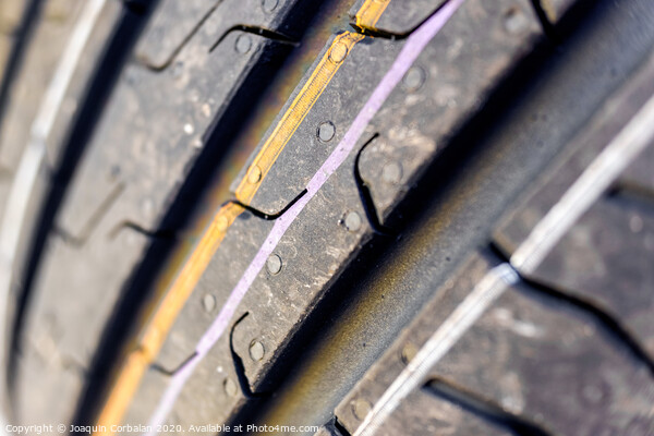 Detail of the grooves of a new car tire. Picture Board by Joaquin Corbalan