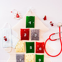 Buy canvas prints of Traditional advent calendar protected with medical face masks, isolated on white background. by Joaquin Corbalan