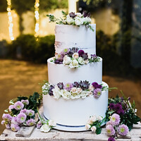 Buy canvas prints of Pretty three-tier wedding cake decorated for a wedding event. by Joaquin Corbalan