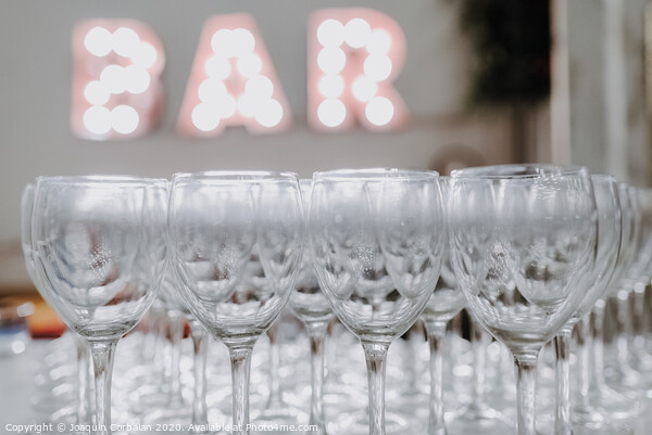 Empty glasses on a bar counter for drinking alcohol. Picture Board by Joaquin Corbalan