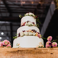 Buy canvas prints of Pretty three-tier wedding cake decorated for a wedding event. by Joaquin Corbalan