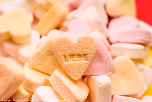 Word love written in German on a candy heart, sweet image for Va Picture Board by Joaquin Corbalan