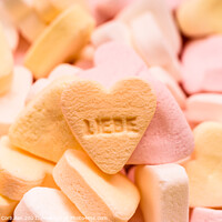 Buy canvas prints of Word love written in German on a candy heart, sweet image for Va by Joaquin Corbalan