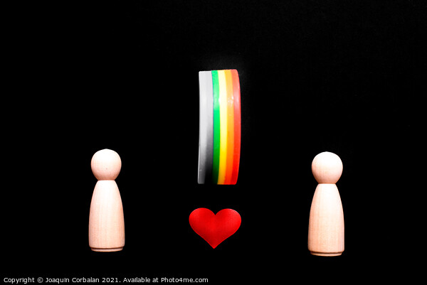 Wooden figures representing two lesbian women in love, with the  Picture Board by Joaquin Corbalan