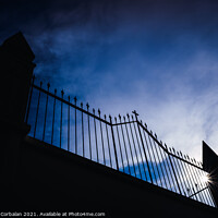 Buy canvas prints of Metal grating of a cemetery with a cross on a white wall, copy s by Joaquin Corbalan