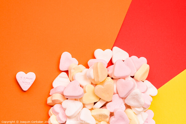 Word love in English on a candy heart, sweet image for Valentine Picture Board by Joaquin Corbalan