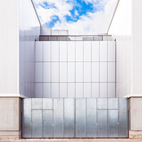 Buy canvas prints of Facade of a door of an industrial warehouse made of gleaming alu by Joaquin Corbalan