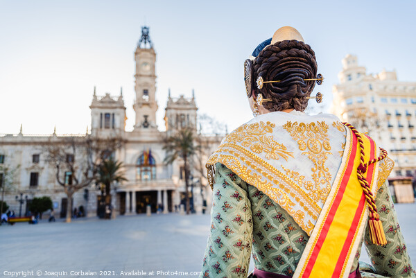 Woman dressed as a Fallera with her back turned, observes the facade of the Valencia City Hall, out of focus in the background. Picture Board by Joaquin Corbalan