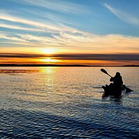 Buy canvas prints of Kayaking under an Orkney sunset  by Myles Campbell