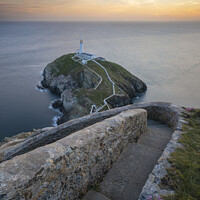 Buy canvas prints of Sunset at South Stack Lighthouse in Anglesey, North Wales by Katie McGuinness