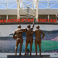 Buy canvas prints of The Holy Trinity statue, (Best, Law and Charlton)  by Katie McGuinness