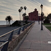 Buy canvas prints of Benalmadena paseo at sunset by Heather McGow