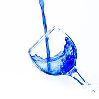 Buy canvas prints of Pouring water into a wine glass by David Strange