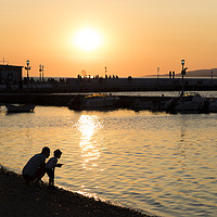 Buy canvas prints of Father and Son in Mykonos by Anthony Rosner