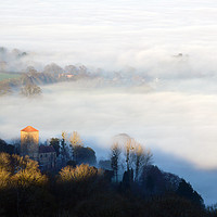 Buy canvas prints of Looking down on Little Malvern Priory on a misty w by David Wall