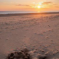 Buy canvas prints of Holkham Beach Sandcastle & Sunrise by Neal Trafankowski