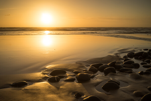 Sunset pebbles Picture Board by Tony Twyman