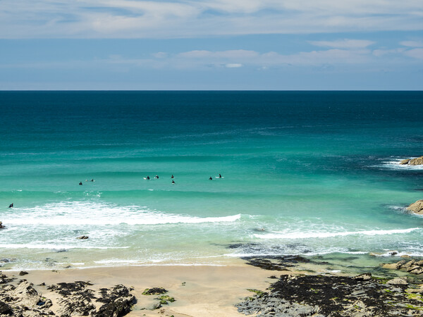 Surfers watching for waves at Little Fistral beach Picture Board by Tony Twyman