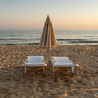 Buy canvas prints of Sun beds on Falesia Beach in Portugal by Tony Twyman