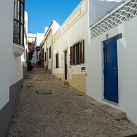Buy canvas prints of The cobbled streets of Albufeira by Tony Twyman