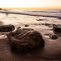Buy canvas prints of Sunrise on Oura Beach shoreline by Tony Twyman