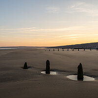 Buy canvas prints of Weathered Groynes at sunrise by Tony Twyman