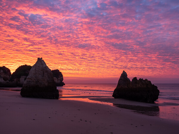 Sunrise rock stacks at Alvor Picture Board by Tony Twyman