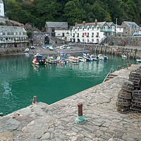 Buy canvas prints of The timeless Clovelly quayside in North Devon by Tony Twyman