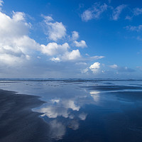 Buy canvas prints of Wonderful cloud reflections on Westward Ho beach by Tony Twyman