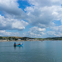 Buy canvas prints of Fishing boat returning to Bideford in Devon by Tony Twyman