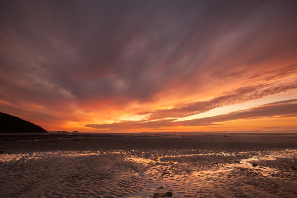 Sunset at Sandbay in North Somerset Picture Board by Tony Twyman