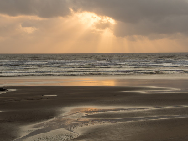 Ray of sunlight through the clouds at Westward Ho! Picture Board by Tony Twyman