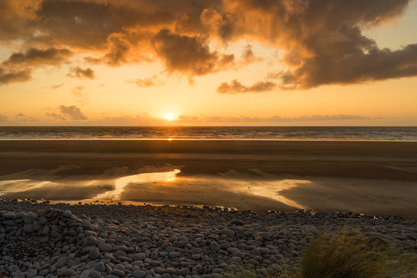 Beautiful golden sunset at Westward Ho! in Devon Picture Board by Tony Twyman