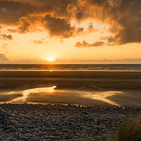 Buy canvas prints of Beautiful golden sunset at Westward Ho! in Devon by Tony Twyman