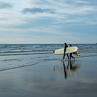 Buy canvas prints of Surfer couple entering the sea at Westward Ho! by Tony Twyman