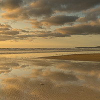 Buy canvas prints of Reflective sunset clouds at Westward Ho! in Devon by Tony Twyman