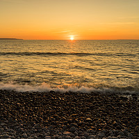 Buy canvas prints of Westward Ho pebble beach sunset  by Tony Twyman
