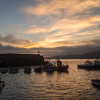 Buy canvas prints of Sunrise over the fishing boats of Clovelly  by Tony Twyman