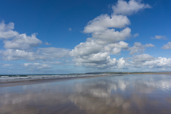 Clouds reflecting on a deserted Westward Ho beach Picture Board by Tony Twyman