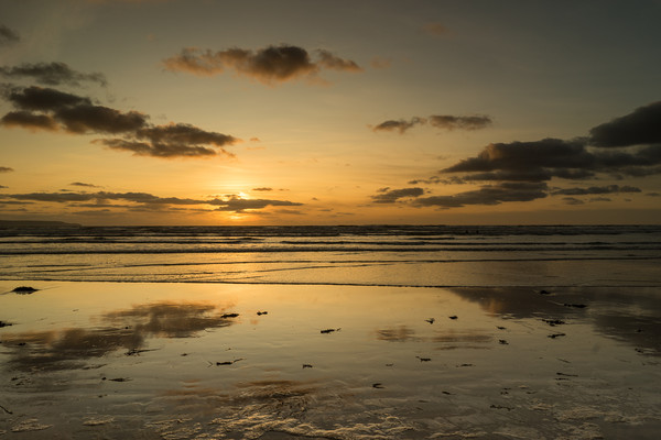 Reflective sunset at Westward Ho in Devon Picture Board by Tony Twyman