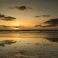 Buy canvas prints of Reflective sunset at Westward Ho in Devon by Tony Twyman