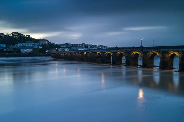 Moody sunrise at Bideford Long Bridge in Devon Picture Board by Tony Twyman